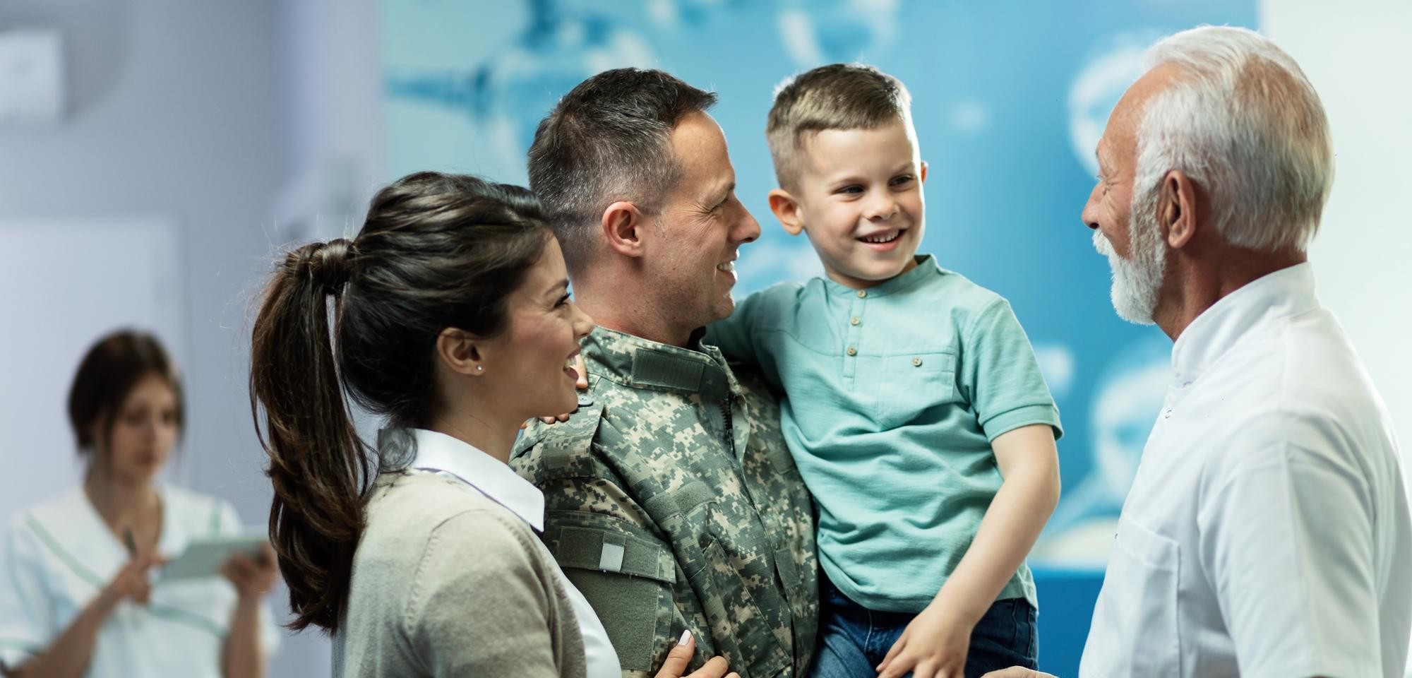 A military family smiling together while visiting Fort Leonard Wood